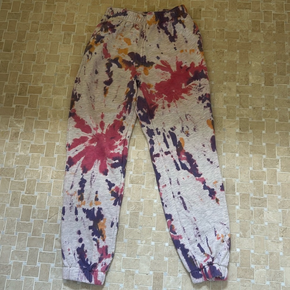 Adika pink, white, and orange sweatpants.